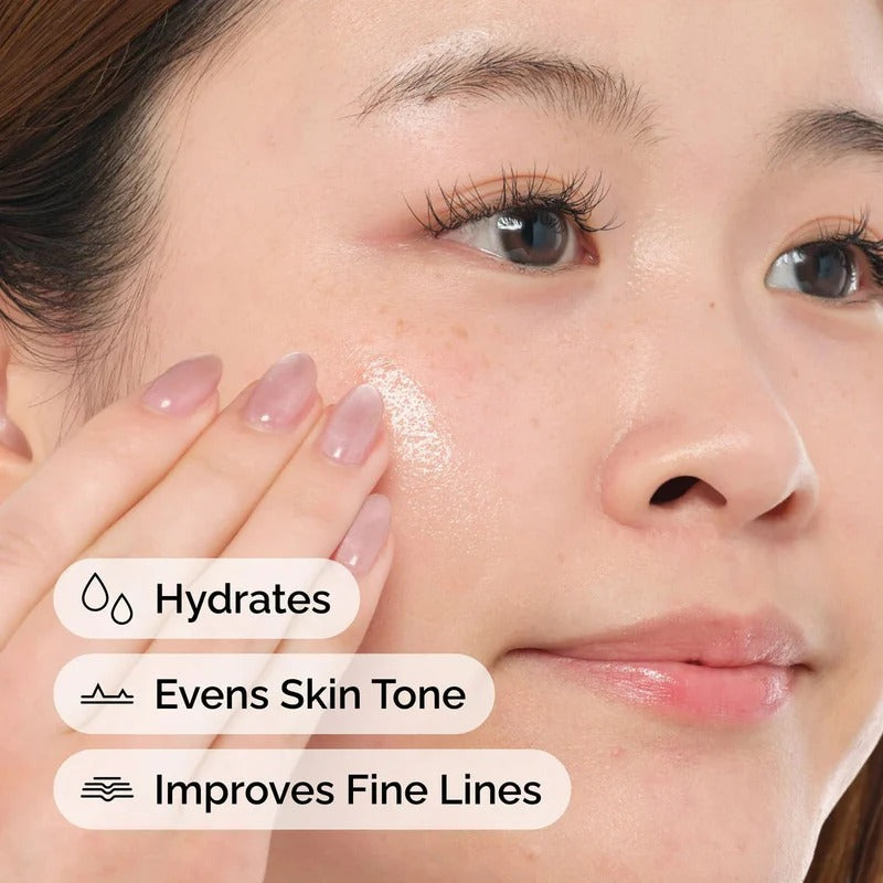 Girl applying serum: hydrates skin, improves elasticity, reduces fine lines, brightens complexion, and promotes healthy glow
