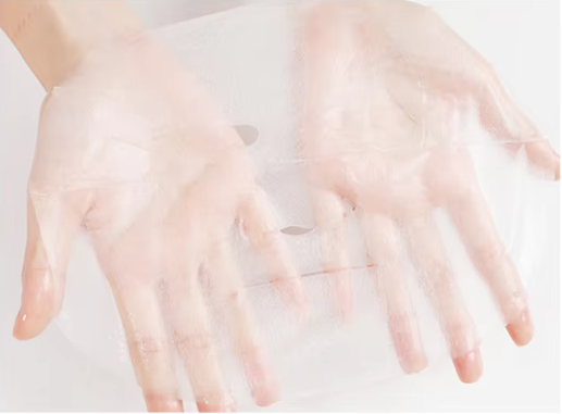Sheet face mask coated with nourishing serum for intense hydration, skin rejuvenation, and a smoother, glowing complexion.